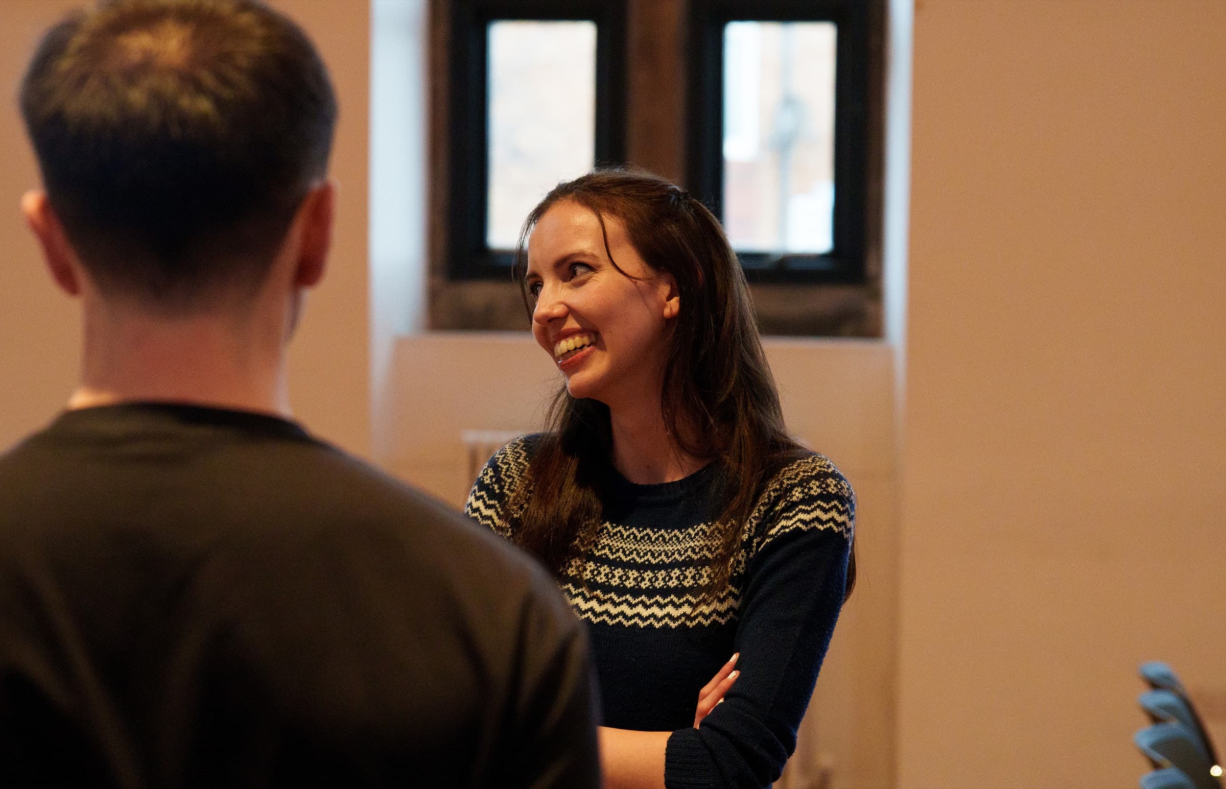 A member of C3 Edinburgh smiling during a conversation after the service