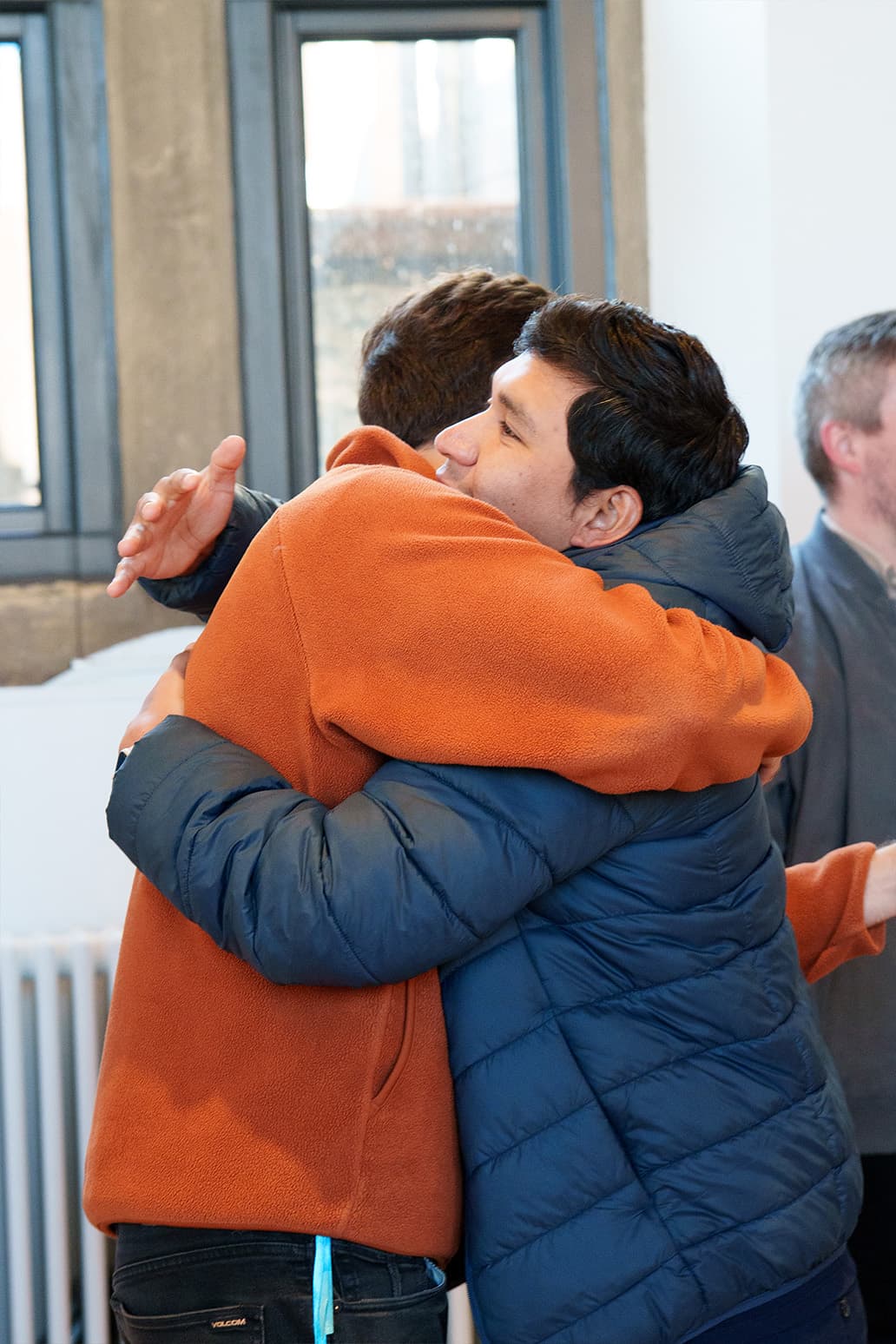 Two members of C3 Edinburgh embracing warmly after a service